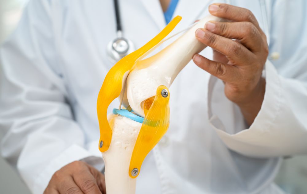 DOctor explaining why only one knee is treated at a time with GAE