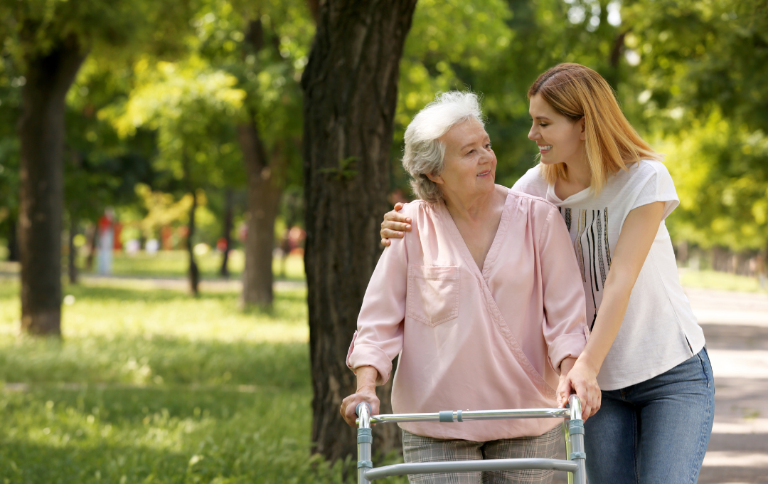 Older woman needing assistance to walk.