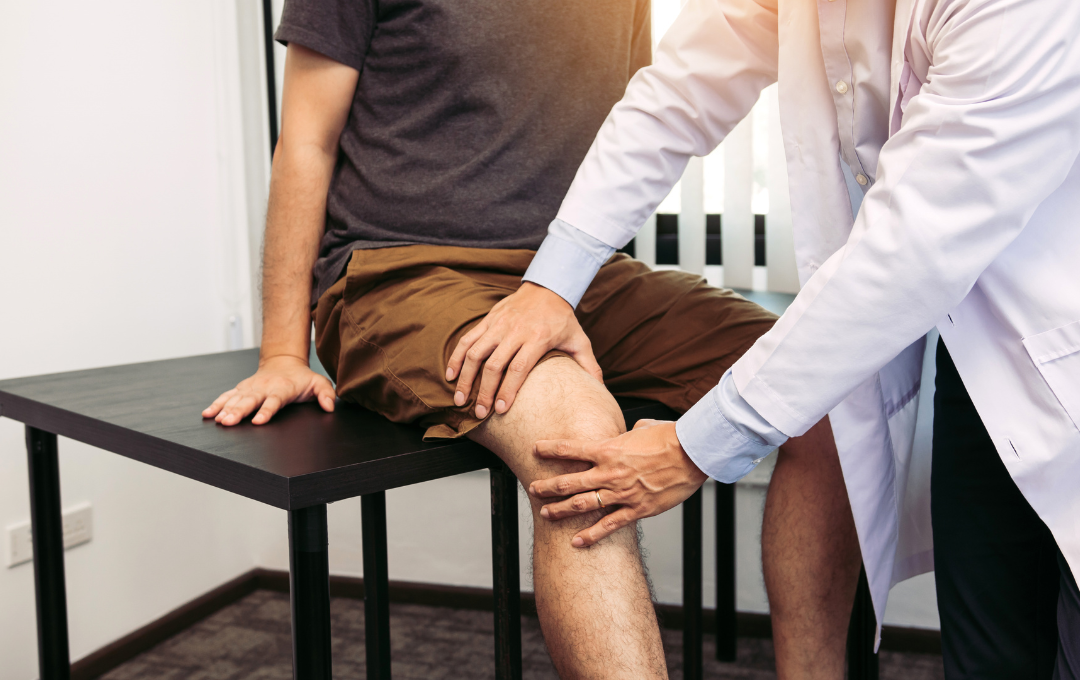 Physical therapist guiding low-impact knee strengthening exercise session